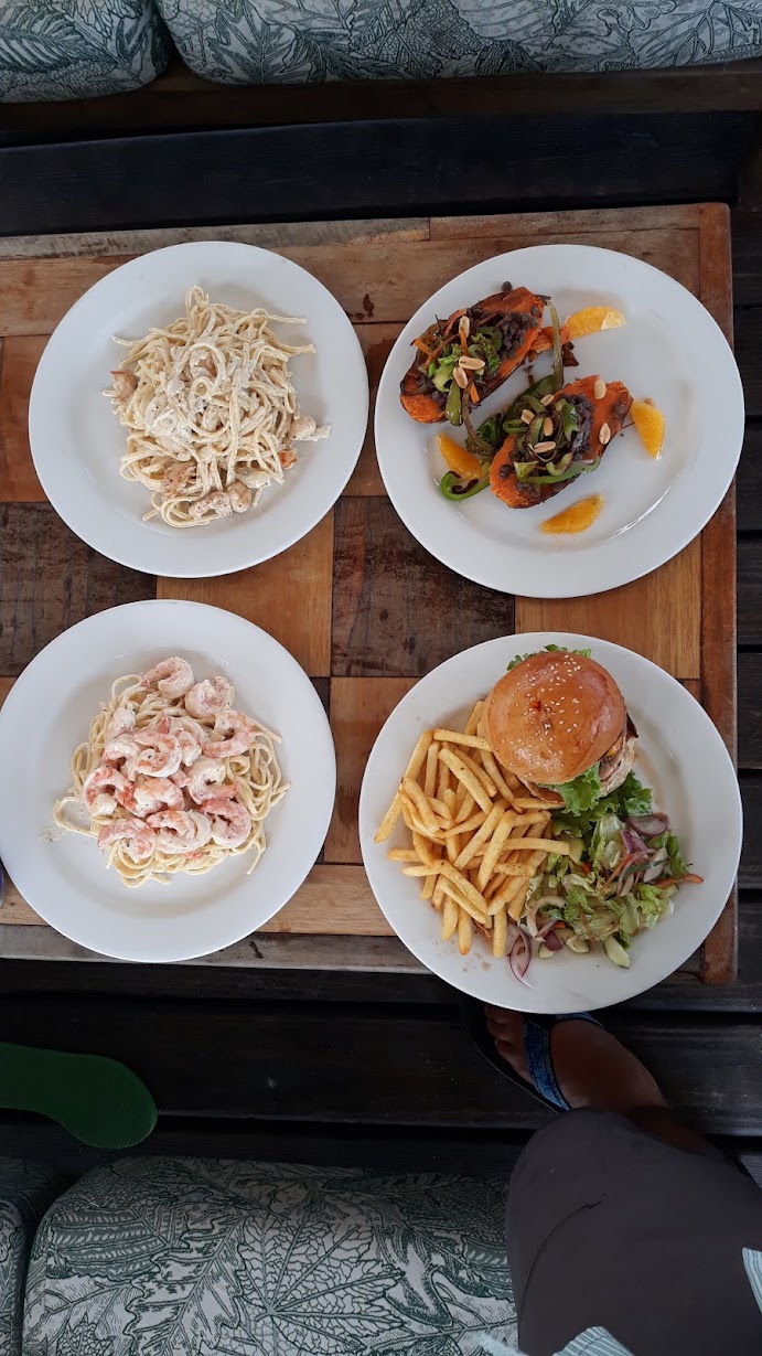 Four restaurant meals on a table in Seine Bight